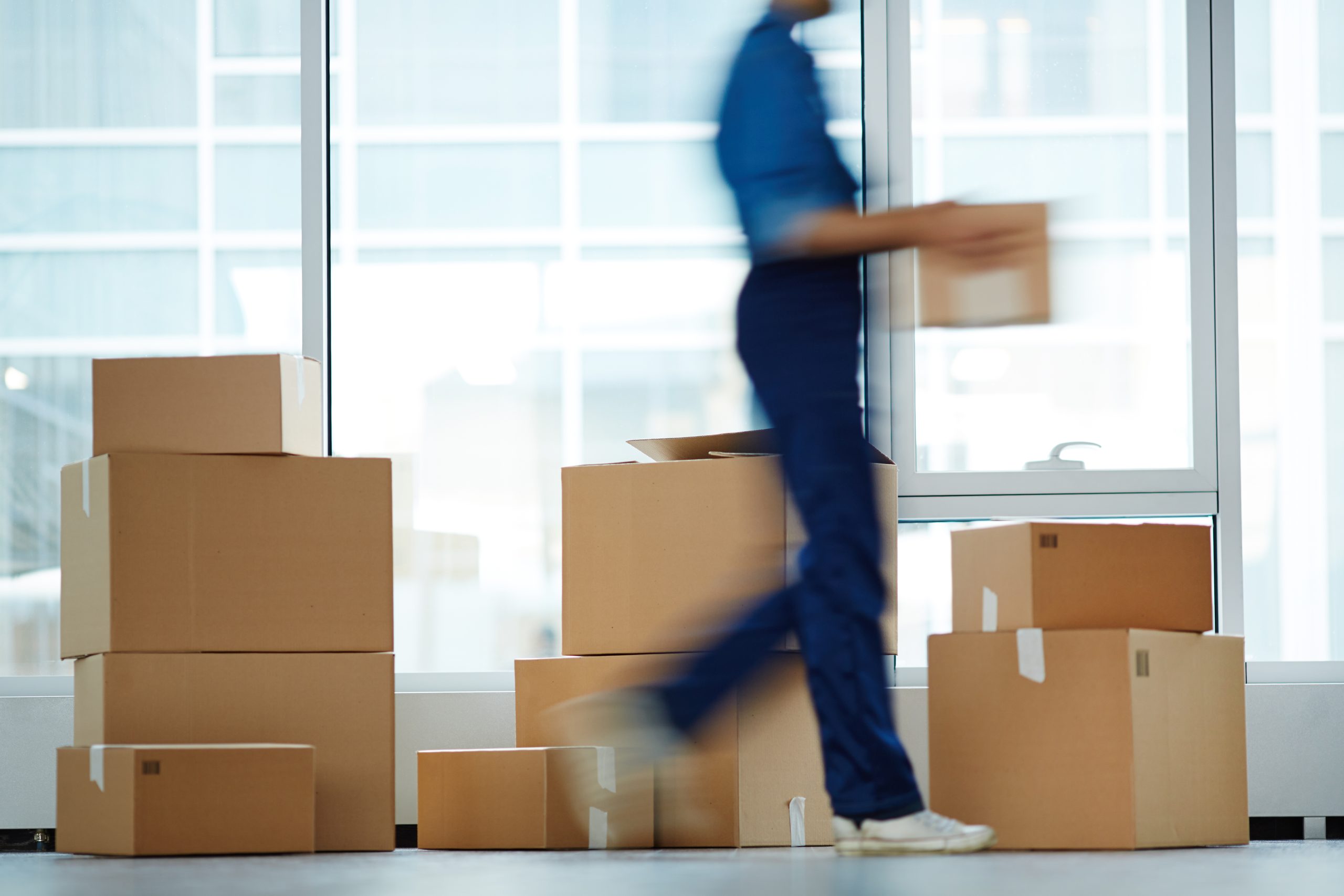 Blurry,Outline,Of,Delivery,Service,Staff,Moving,And,Carrying,One
