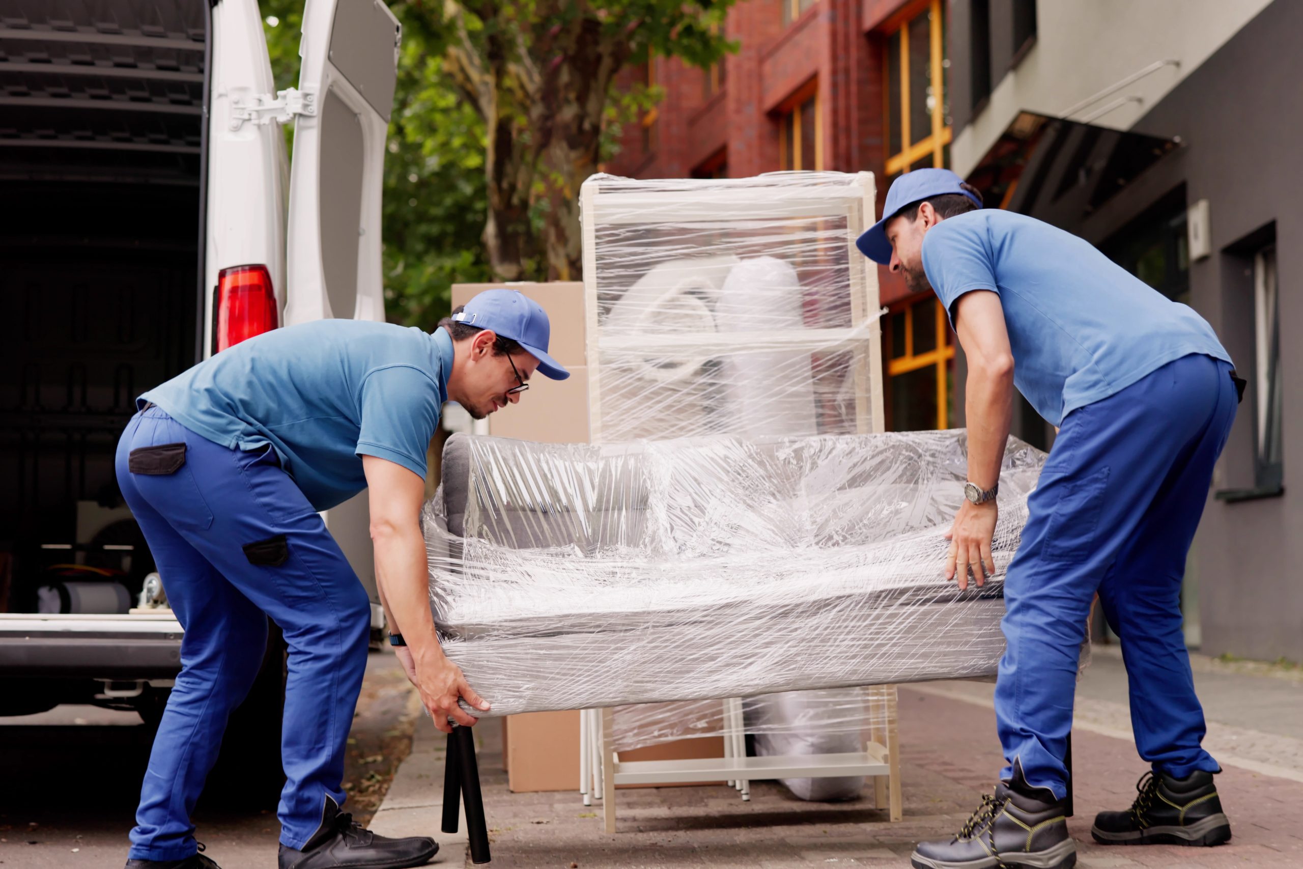 Professional,Movers,Outside,Delivering,Furniture,Removal,Service,With,Truck,And